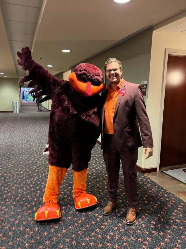 Normand Adams with the HokieBird at the Dept. of Agricultural and Applied Economics Career Fair in 2022